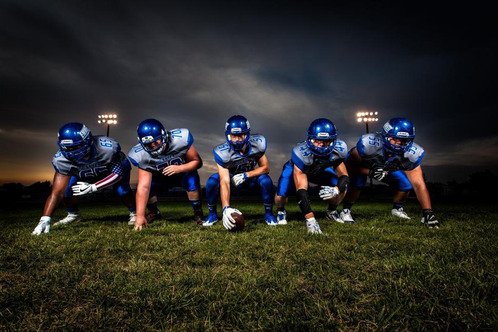 Free Image of American football Players with dark clouds  