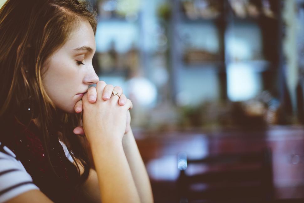 Free Image of Woman praying with folded hands  
