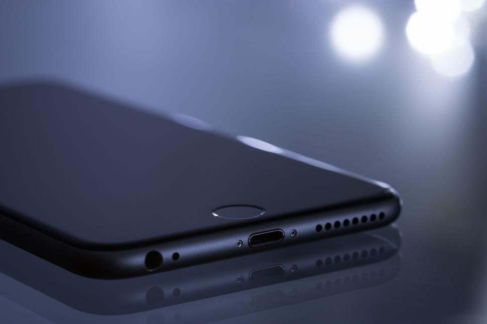 Free Image of iPhone on glass table  