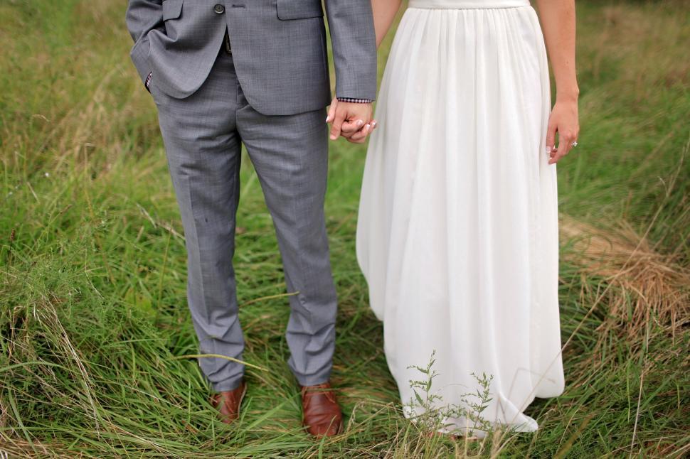 Free Image of Bride and Groom on Grass  