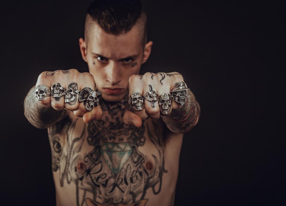 Free Image of Tattooed man with skull rings 