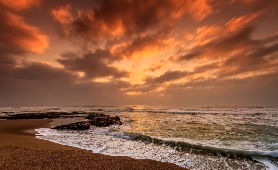 Free Image of Seashore and Sunset Clouds  