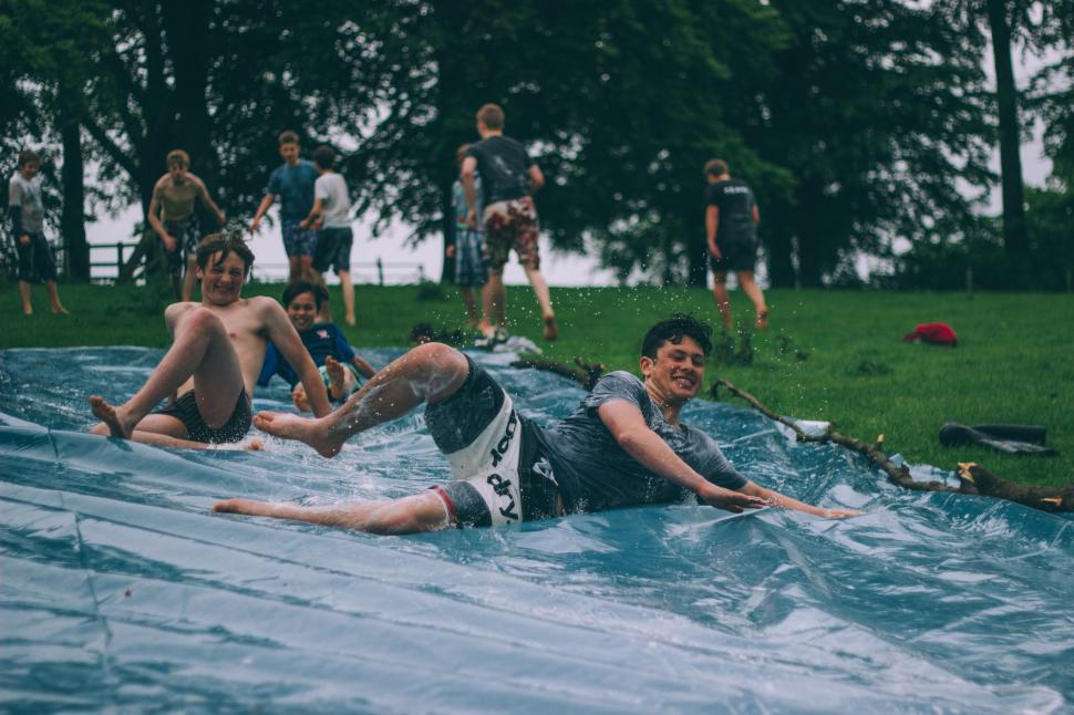 Free Image of Group of friends enjoying water sports in the park 