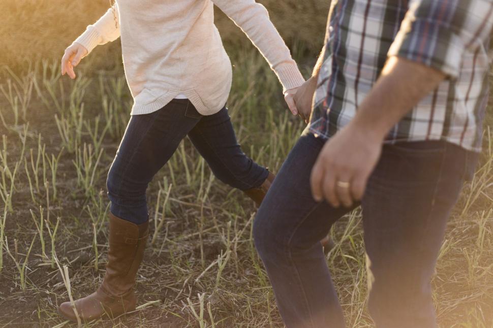 Free Image of Couple Holding Hands  