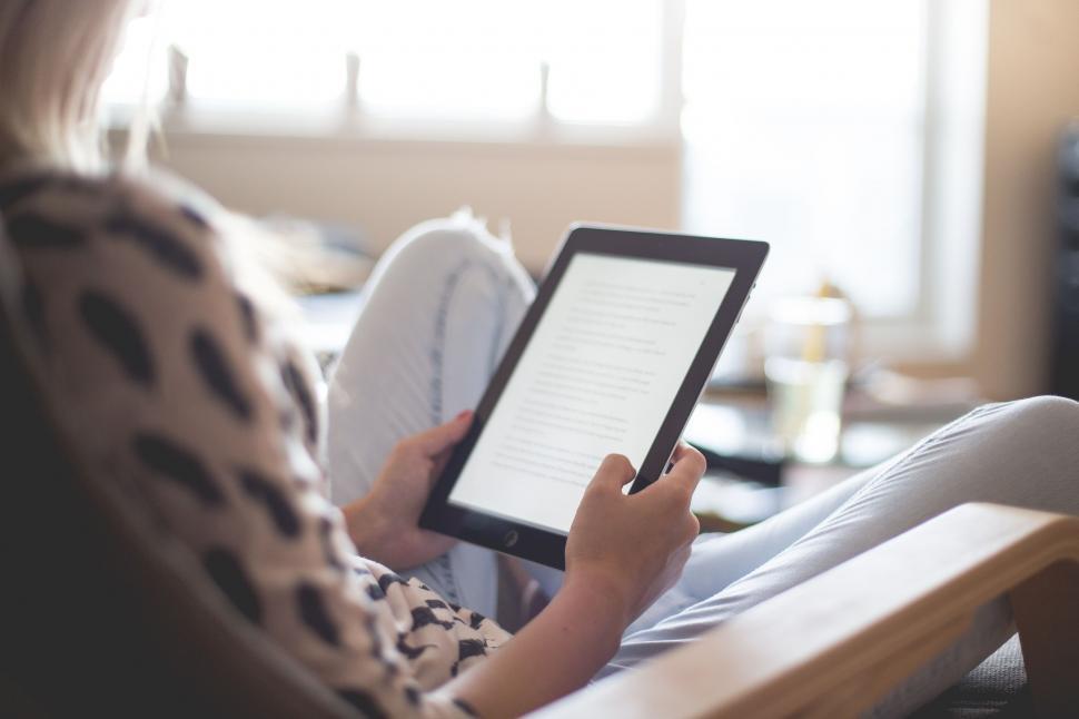 Free Image of Reading on Tablet  
