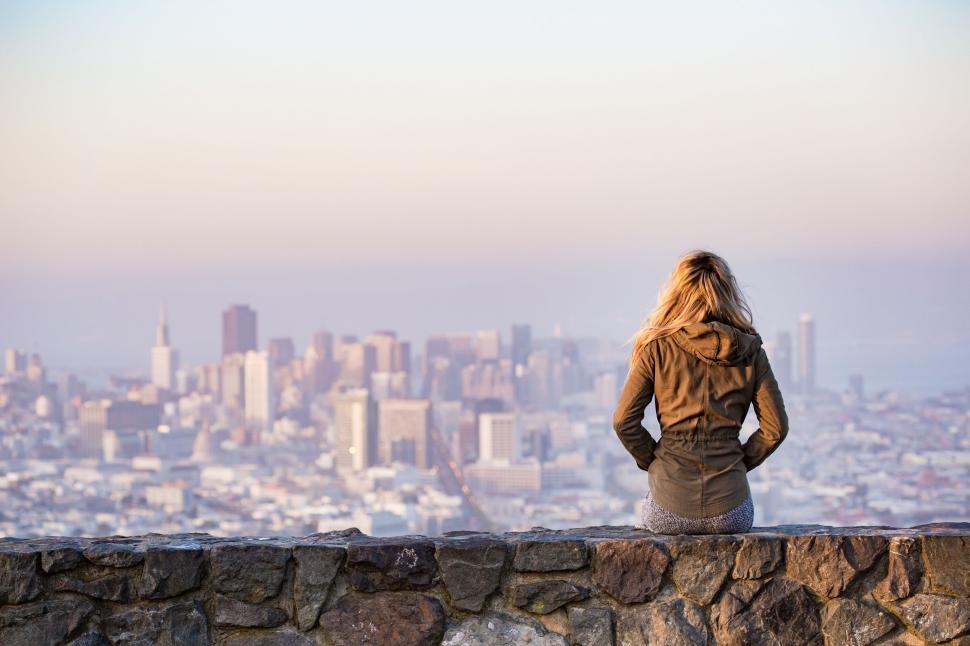 Free Image of Blonde Woman with city in the background  