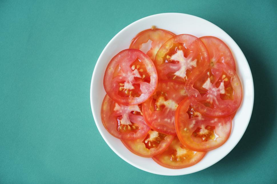 Free Image of Close up of tomato slices on white plate 