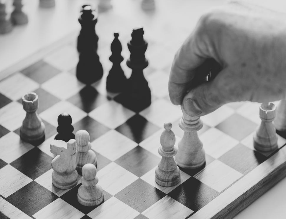Free Image of Close up of a person playing chess 