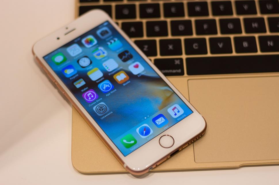 Free Image of iPhone and Macbook Gold Laptop 