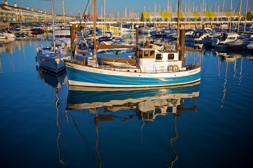 Free Image of Blue and White Boat Floating in Water 