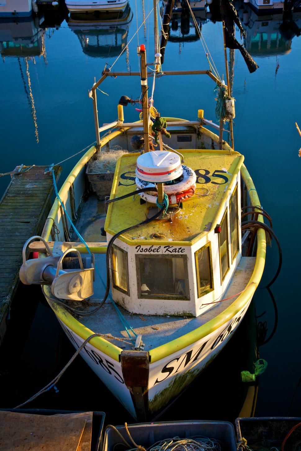 Free Image of Yellow and White Boat Docked at a Dock 