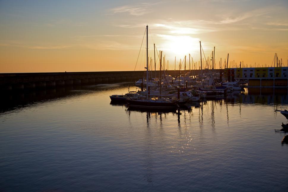 Free Image of Busy Harbor With Boats at Sunset 