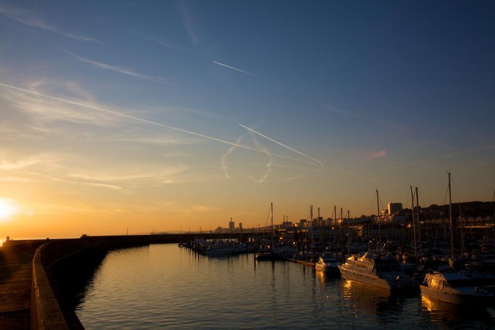 Free Image of Busy Harbor With Numerous Boats Under a Clear Blue Sky 