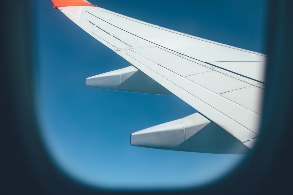 Free Image of Airplane wing and clear blue sky  
