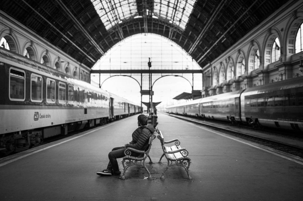 Download Free Stock Photo of Man on railway station bench - Monochrome  
