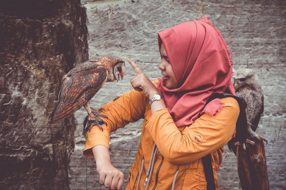 Free Image of Woman with Barn owl on hand 