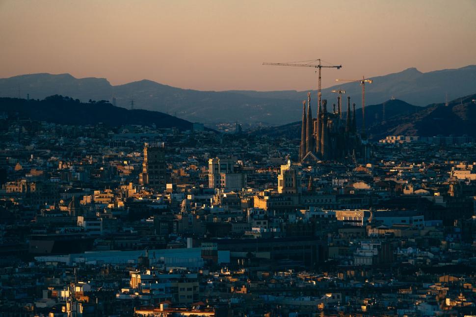 Free Image of View of city of Barcelona with sunset sky   