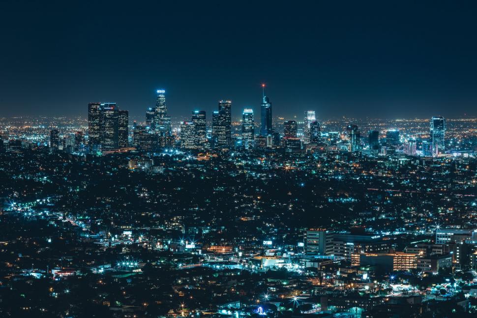 Free Image of City Night Lights With Buildings and Sky  