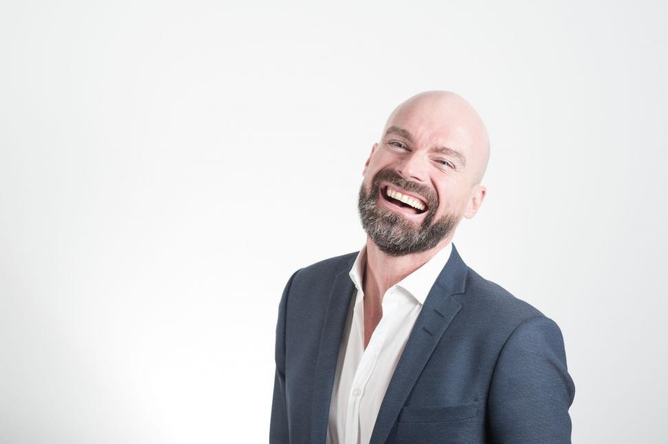 Free Image of Smiling Bald Man with Beard on White Background  