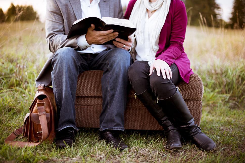 Free Image of Couple Reading in the park 