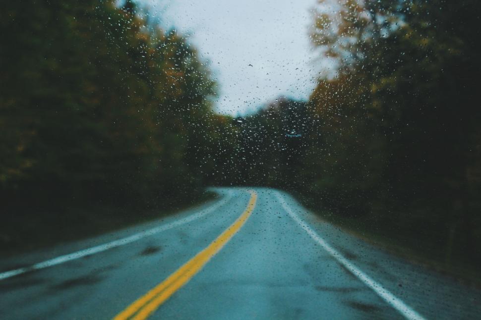 Free Image of Raindrops on the windshield on a rainy day 