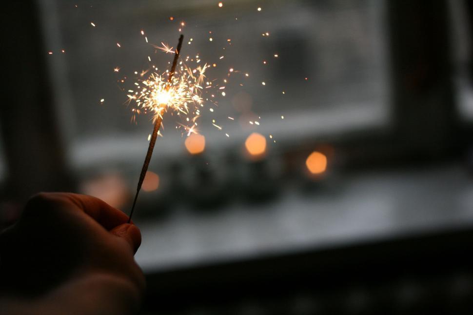 Free Image of Sparkler and Bokeh Lights 