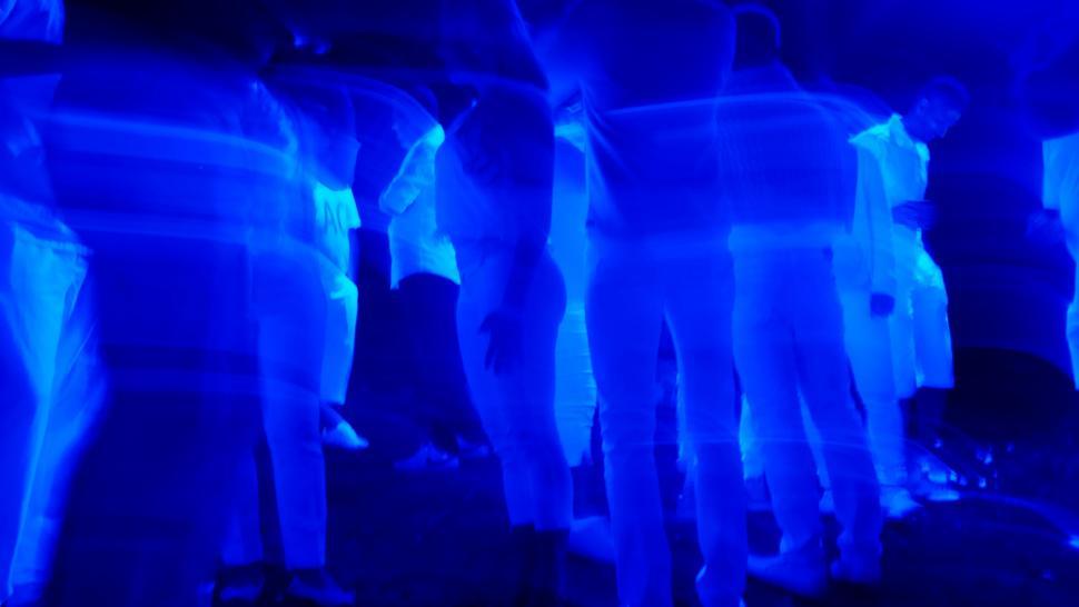 Free Image of People and Blue UV light in bar 