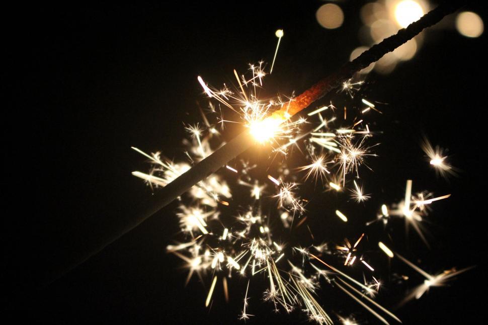 Download Free Stock Photo of Sparkler with yellow sparks 