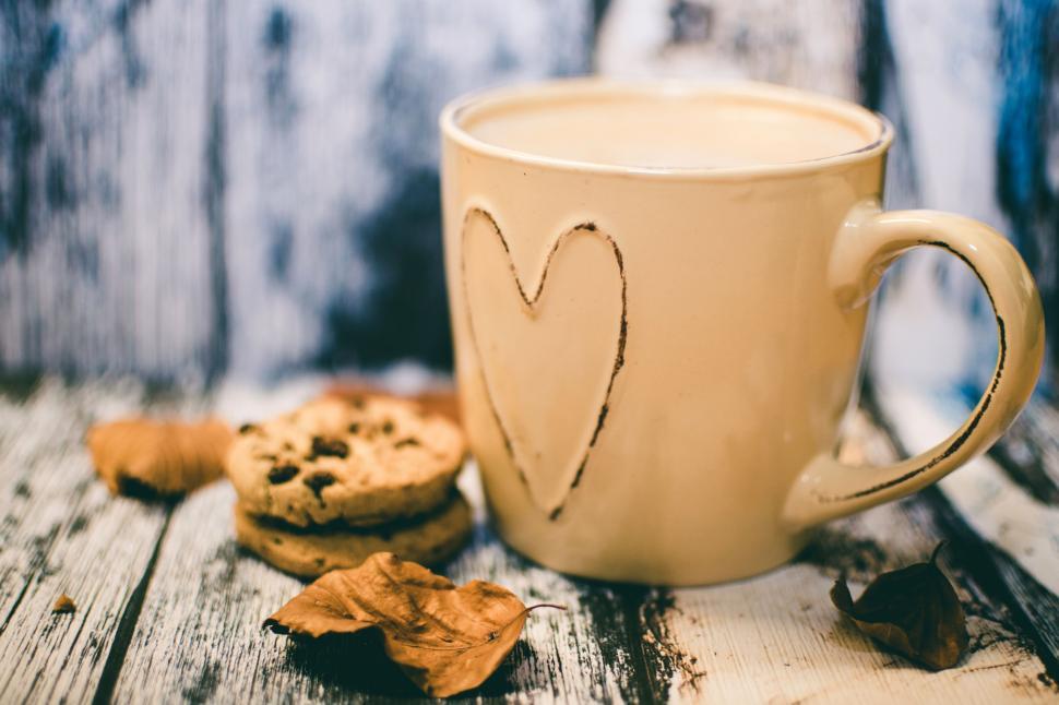 Free Image of Cookies and Coffee Mug With Dried Leaves  