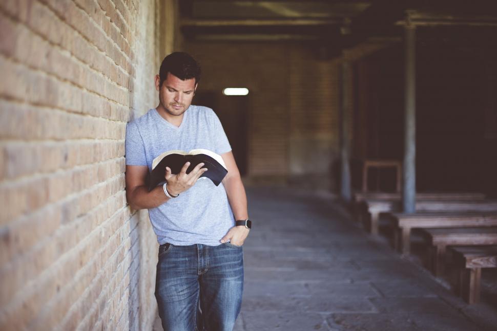 Free Image of Young Man Reading Bible 