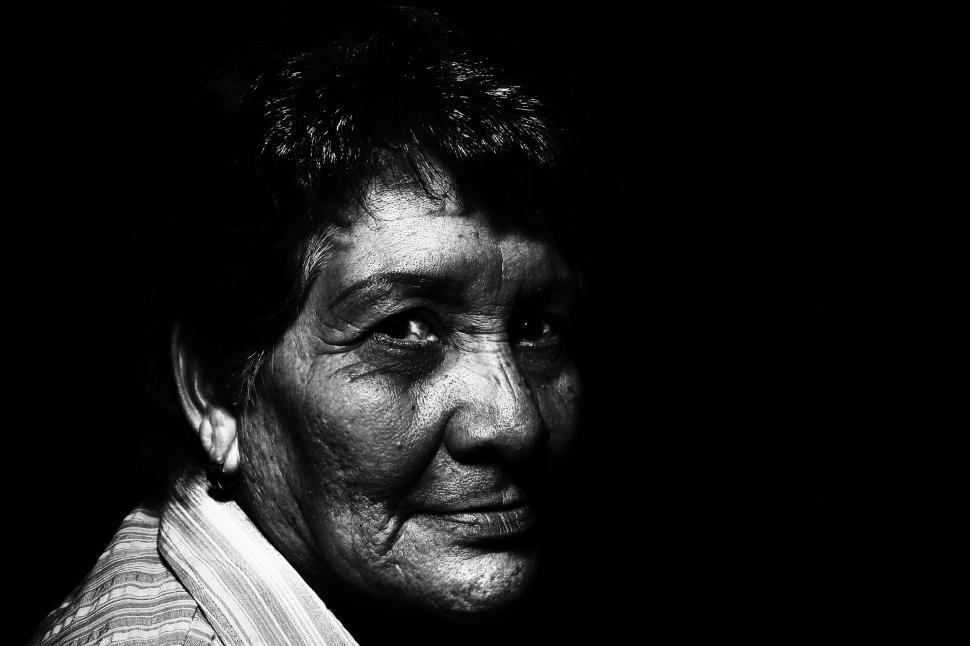 Free Image of Dark View of Elderly Woman on Black Background  
