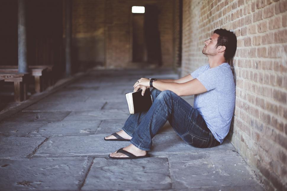 Download Free Stock Photo of Man Sitting With Bible  