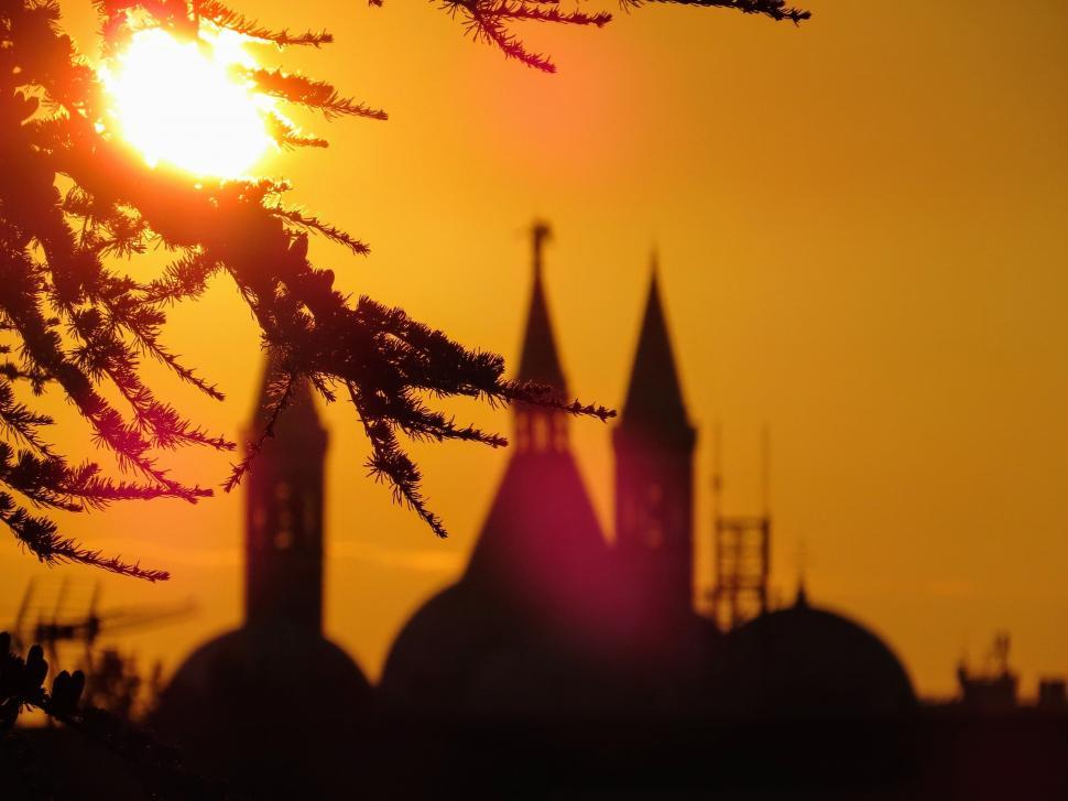 Free Image of Church spires and golden sky  