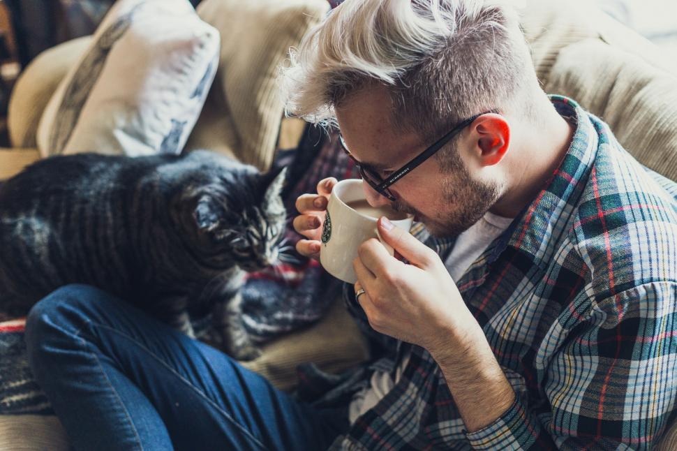 Free Image of Man and Cat on Sofa  