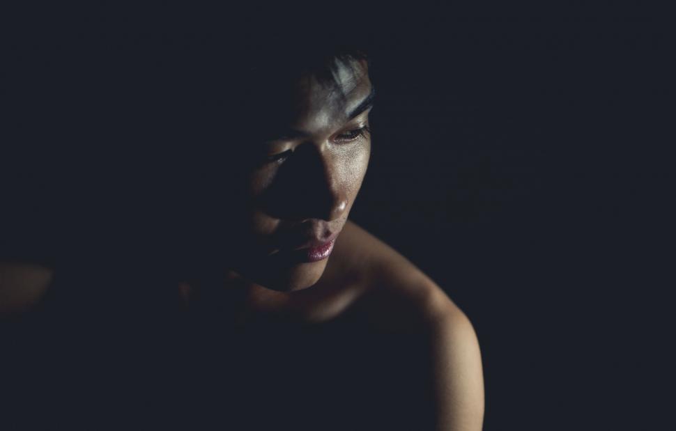 Free Image of Woman Face in Dark Room  