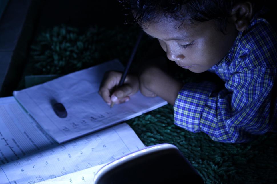 Free Image of Indian Child Writing With Pencil 