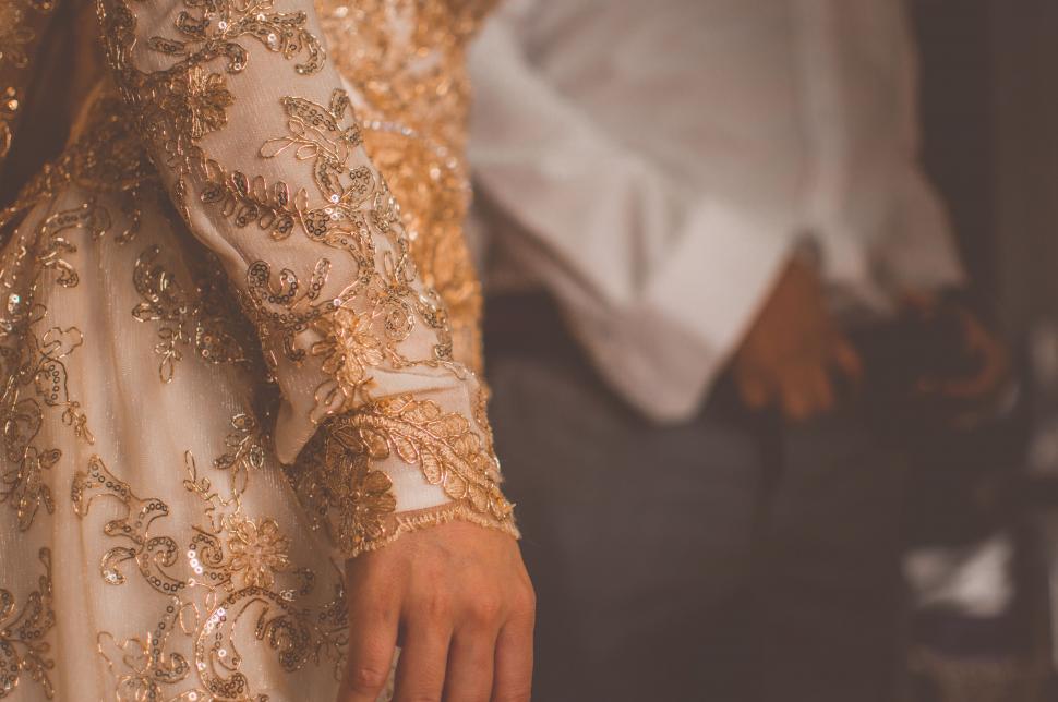 Free Image of Woman Hand in Wedding Dress  