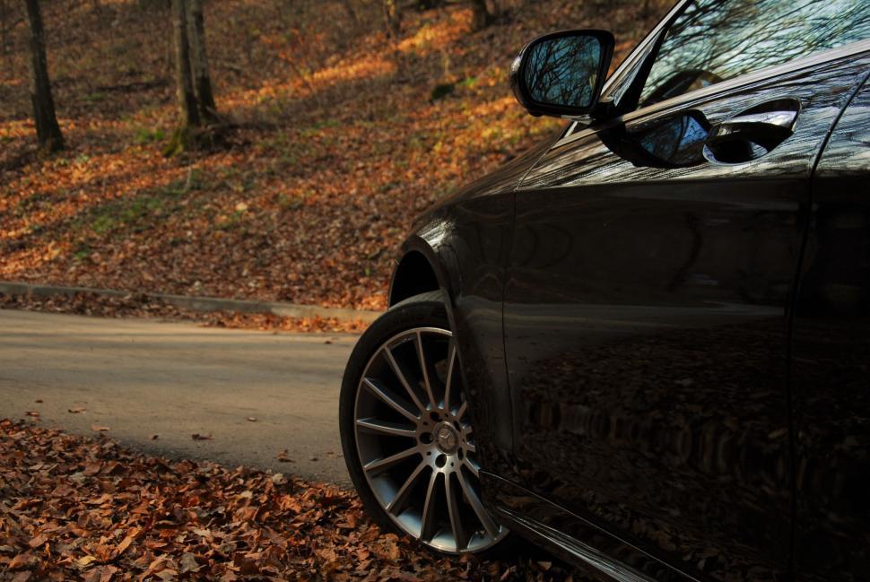 Free Image of Mercedes Car parked on autumn leaves 