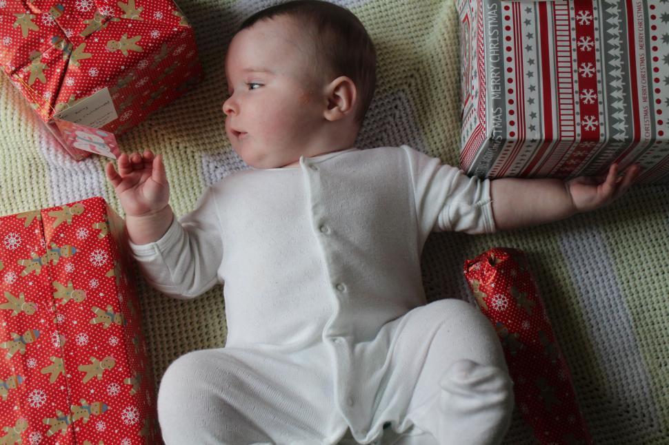 Free Image of Baby With Christmas Gifts 