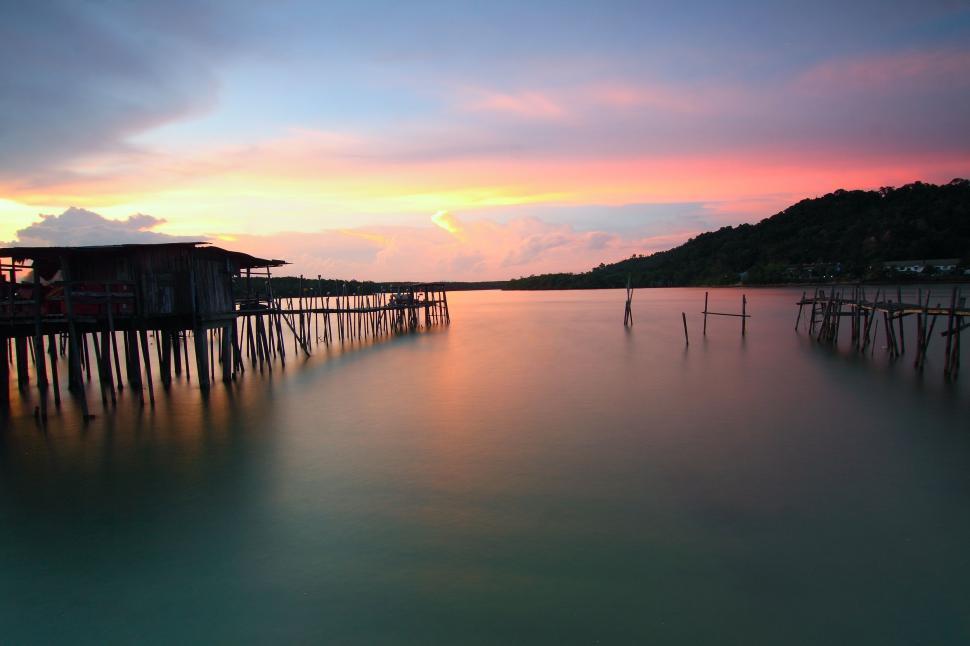 Free Image of Pier and Lake with sunset sky 