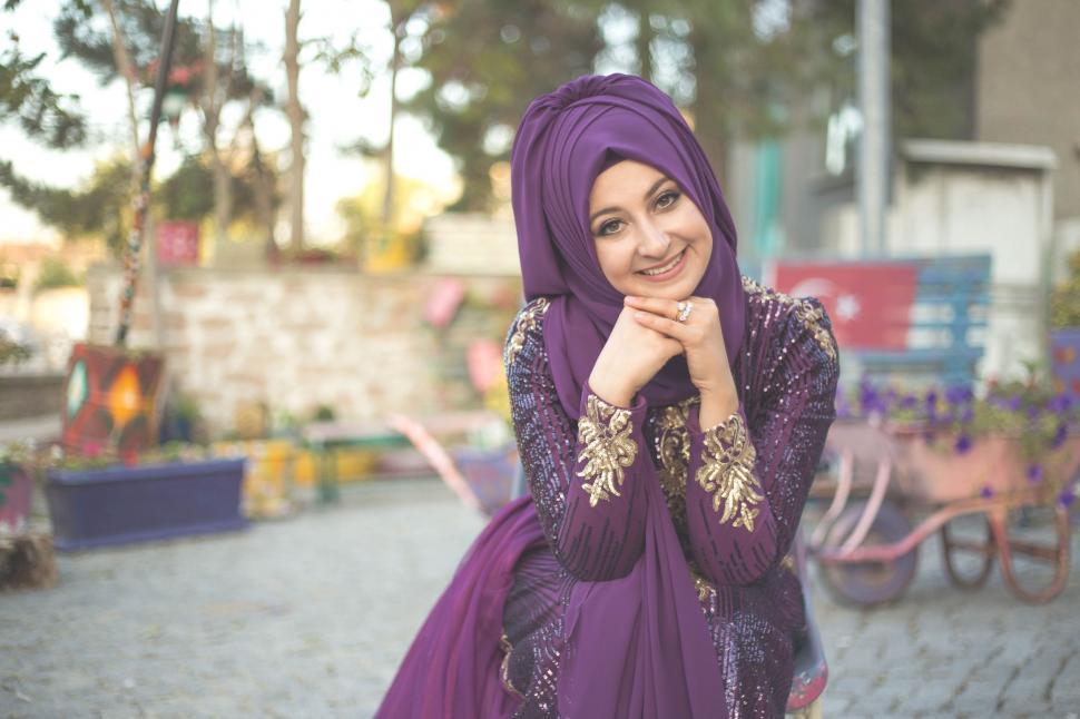 Free Image of Muslim woman in purple dress and hijab 