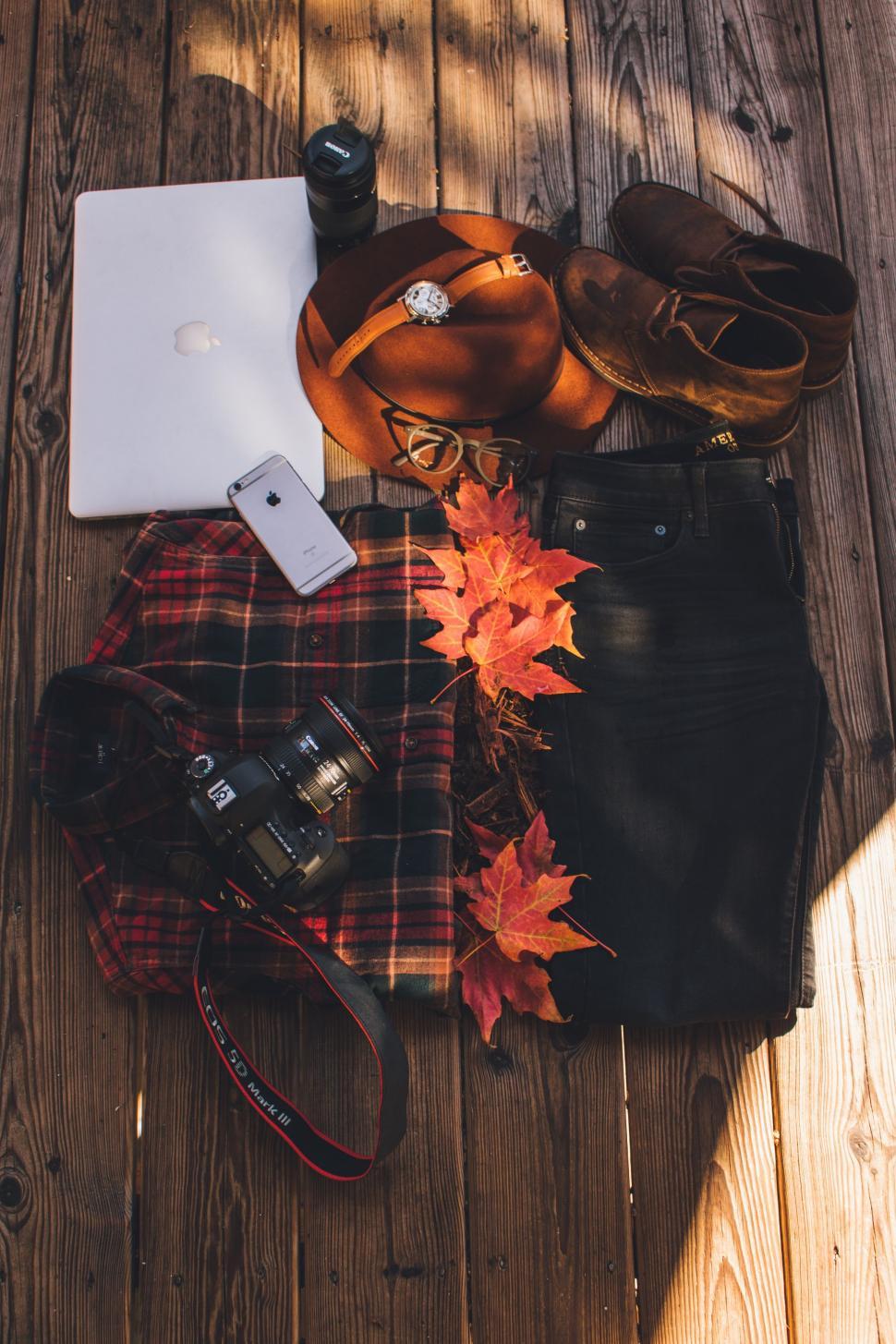 Free Image of Clothes and gadgets with red maple leaves  