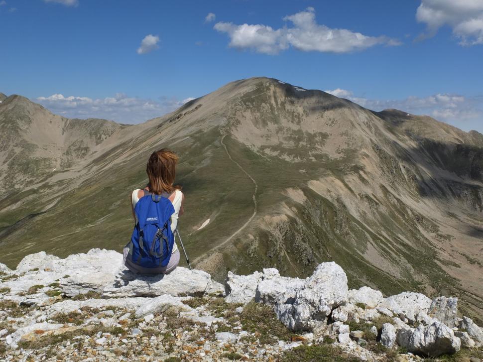 Free Image of Back view of alone woman on mountain  