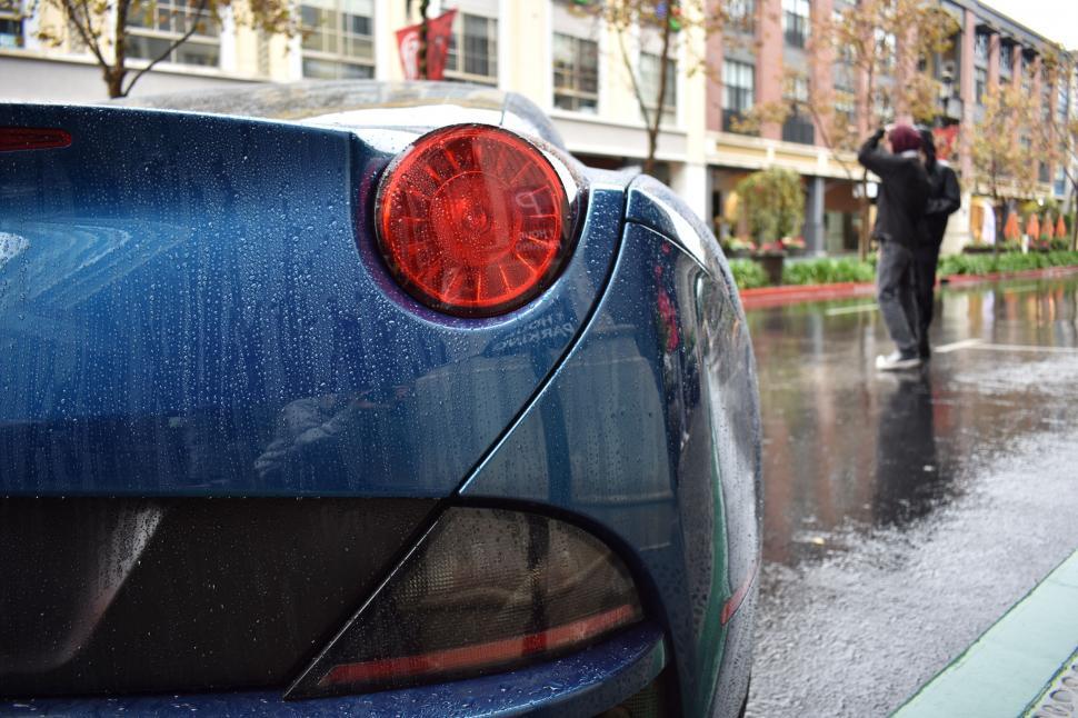 Free Image of Tail Light of car in rain  