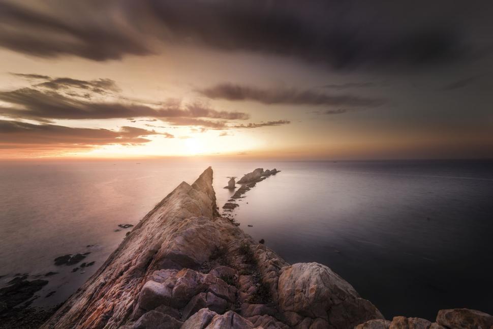 Free Image of Rock and Ocean with sunset  