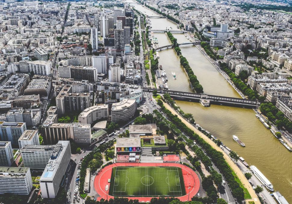 Free Image of Top View of Soccer Field With City  