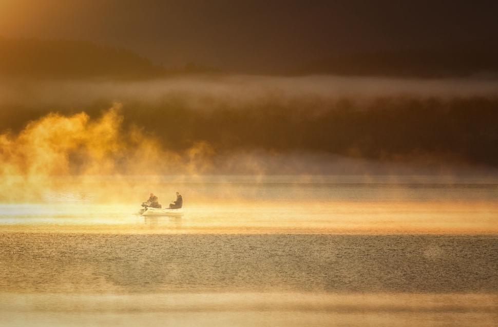 Free Image of Fishermen and Foggy Lake With Yellow Sunlight  