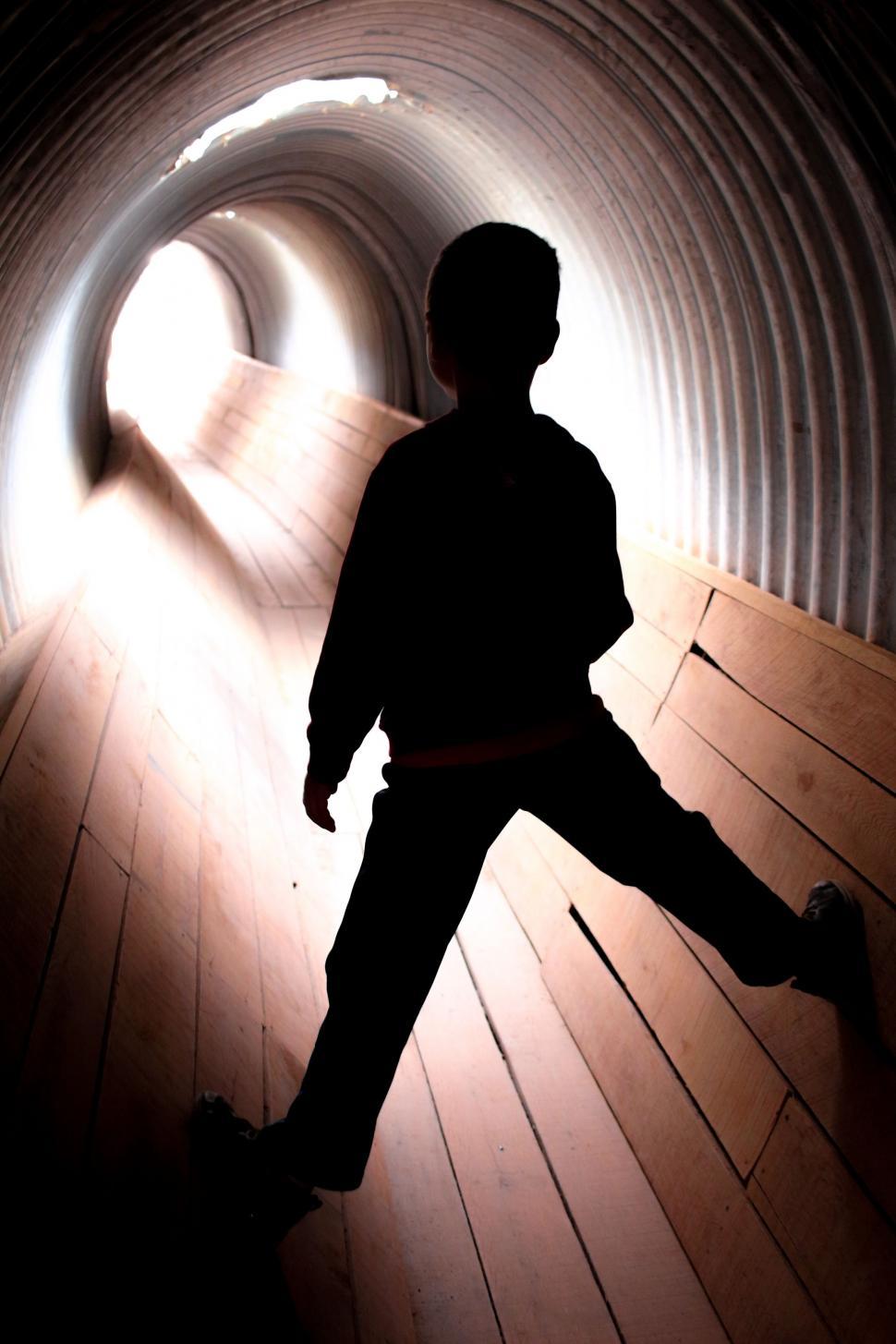 Free Image of Little Boy in Tunnel 
