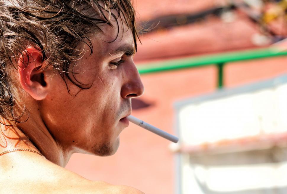 Free Image of Caucasian Man With Cigarette in mouth  