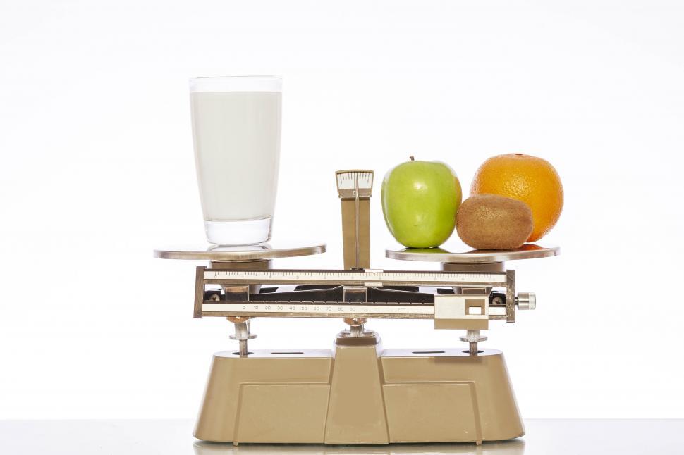Free Image of Milk and Fruit on a Scale 